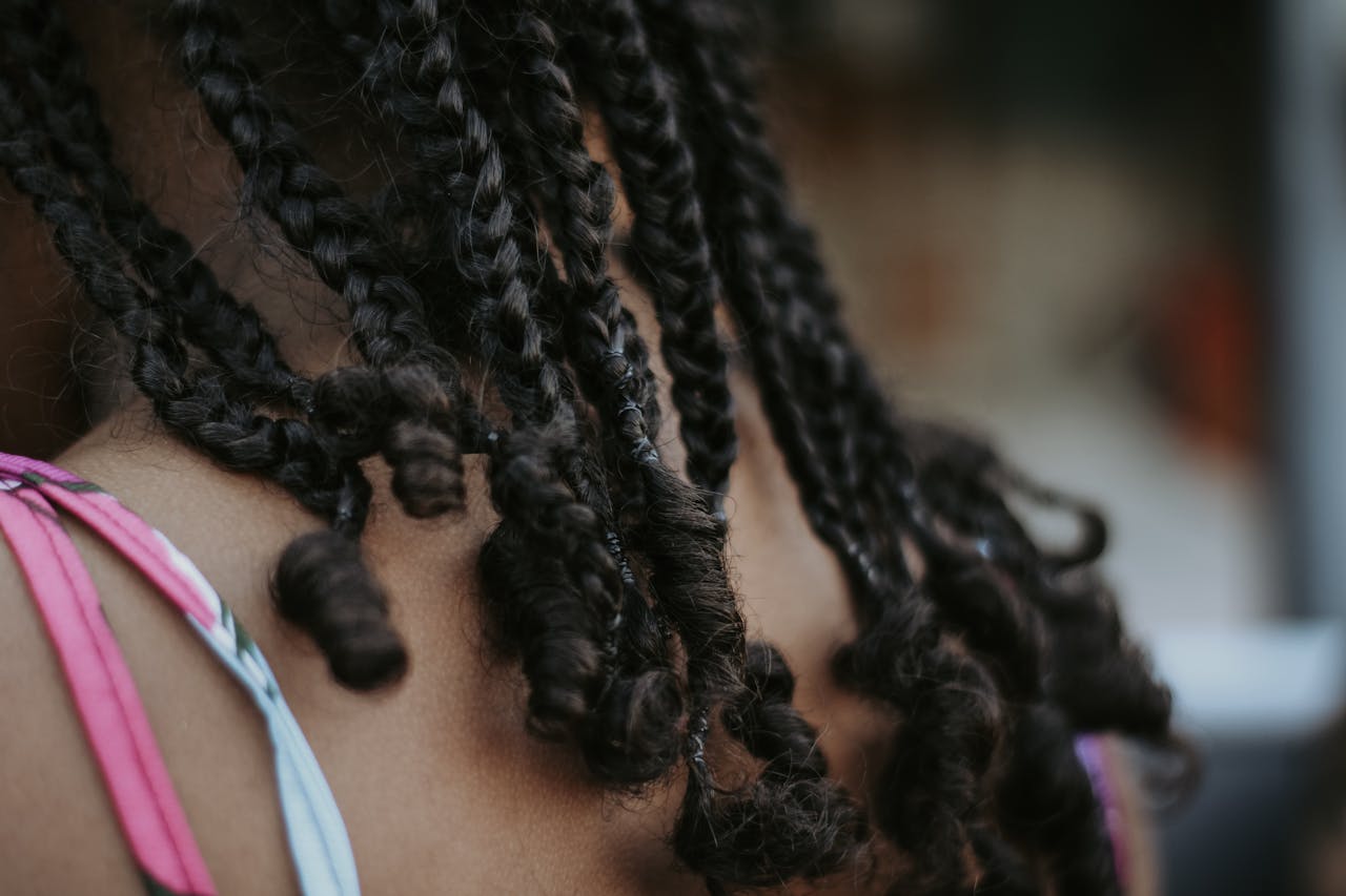 Detailed view of braided hairstyle highlighting texture and style.